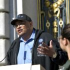 Former San Francisco Public Works Director Mohammed Nuru speaks at a rally asking for walking safety during seventh annual Walk to Work Day at City Hall on April 10, 2019. Speaker of the House Nancy Pelosi, left, and San Francisco Mayor London Breed, center, join then-Transbay Joint Powers Authority Board Chair Mohammed Nuru in turning on a bus schedule screen to celebrate the opening of the new Salesforce Transit Center. Nuru was arrested by the FBI in 2020 on corruption charges.