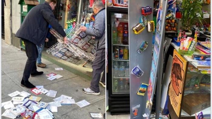 Мужчина помогает владельцу магазина поднять стенд для журналов после того, как группа подростков совершила акт вандализма в магазине в Чайнатауне, Сан-Франциско 16 марта 2020 года.