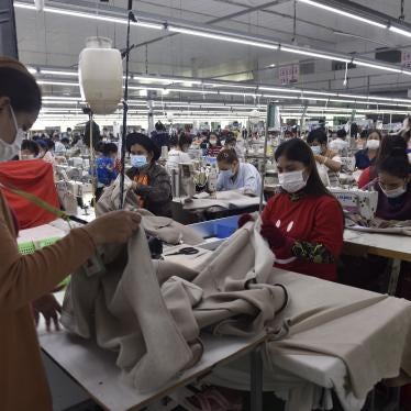 Garment workers make clothes at a factory in Phnom Penh, Cambodia, December 17, 2021.