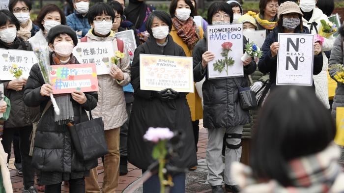 Protesters attend a gathering of the Flower Demo movement against sexual violence in Nagoya, Japan, March 8, 2020.