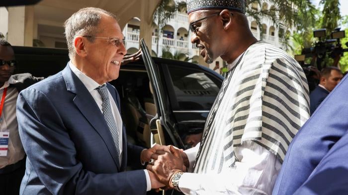 Mali's Foreign Minister Abdoulaye Diop, right, welcomes Russia's Foreign Minister Sergey Lavrov during their meeting in Bamako, Mali, February 7, 2023. 