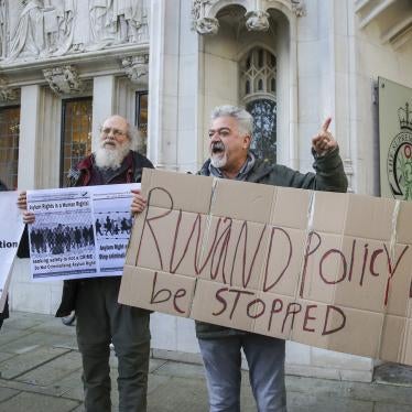 Protesters hold placards outside the UK’s Supreme Court as it rules that the UK Government's Rwanda asylum plan is unlawful, London, United Kingdom, November 15, 2023.