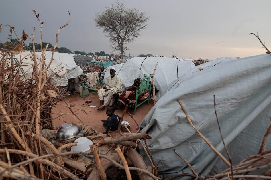 Ismail Mohamed Issa, 65, a 65-year-old Sudanese man, who fled the conflict in Sudan's Darfur region, sits outside his makeshift shelter in Adre, Chad, July 29, 2023. 
