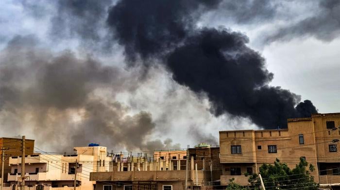 Smoke plumes billow from a fire at a lumber warehouse in Sudan’s capital, Khartoum, amid fighting on June 7, 2023. The fighting, eight weeks in at the time, have pitted Sudan's army chief Abdel Fattah al-Burhan against his former deputy Mohamed Hamdan Daglo who commands the Rapid Support Forces (RSF). 