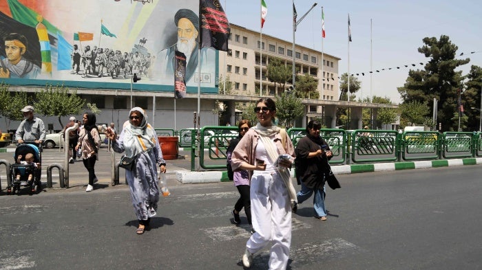 Women walk on the streets of Tehran as Iran’s “morality police” resume hijab patrols, July 18, 2023.