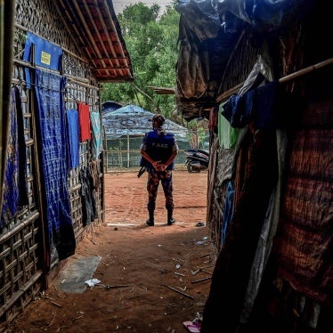 A member of the Armed Police Battalion stands guard at the Kutupalong refugee camp in Ukhia, Bangladesh, October 5, 2021. 