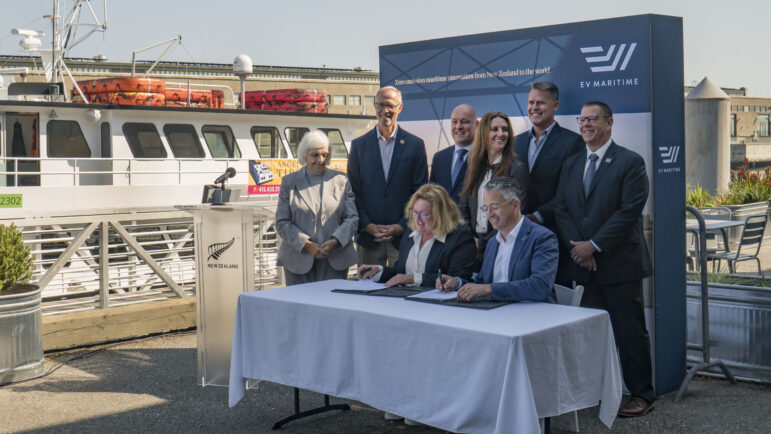 Officials signs a contract at San Francisco's Pier 9.