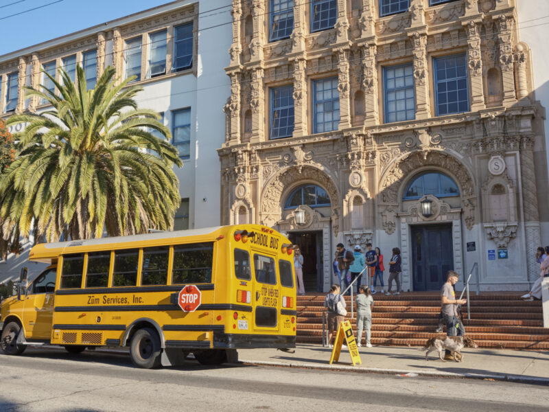 A school bus parked in front of Mission High School in San Francisco.