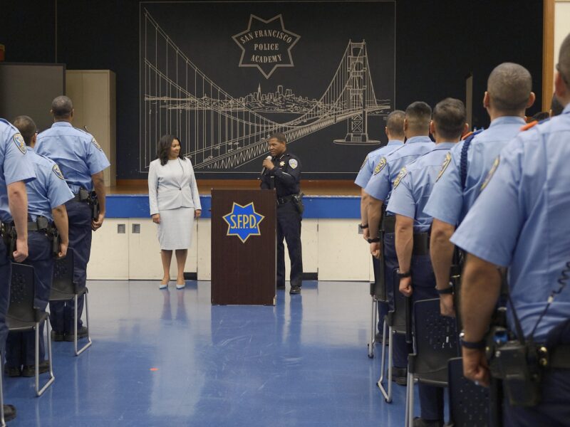 Mayor London Breed and Police Chief Bill Scott address cadets at the police academy.