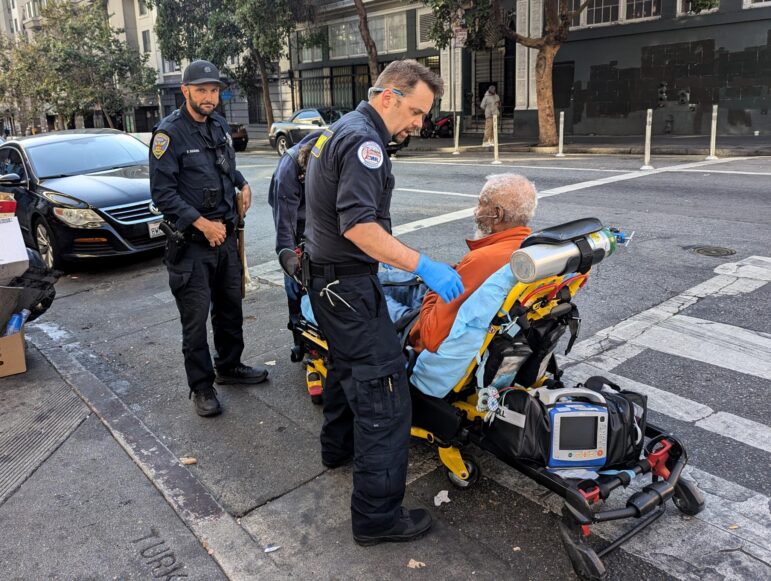 Paramedics help an elderly man in the Tenderloin neighborhood.